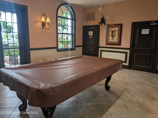 a kitchen with a refrigerator sink and cabinets