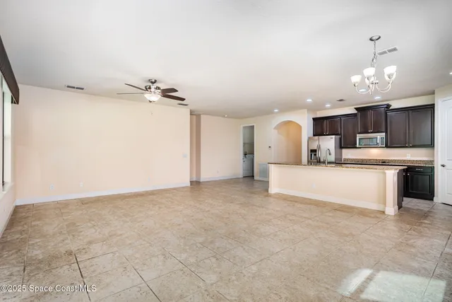 a view of a kitchen with a sink and cabinet area