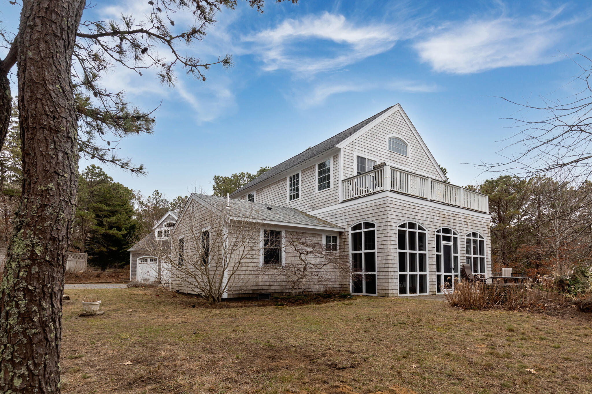 311 South Sunken Meadow Road Eastham, MA 02642 - Photo 5 of 57 a front view of a house with a garden