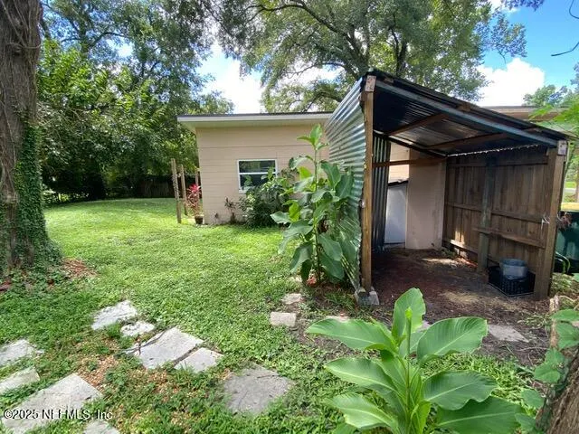a backyard of a house with lots of green space