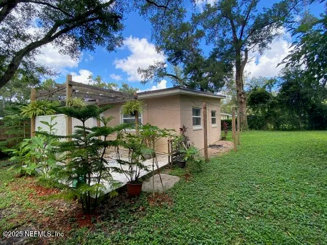 a backyard of a house with lots of green space