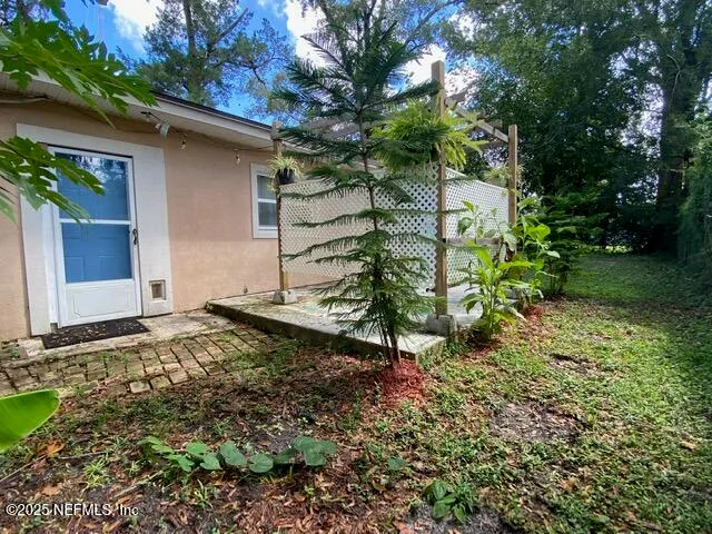 a backyard of a house with lots of green space