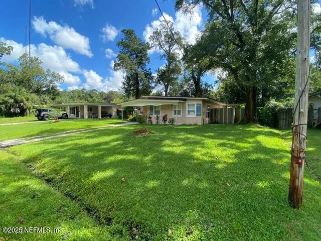 a view of a house with a big yard
