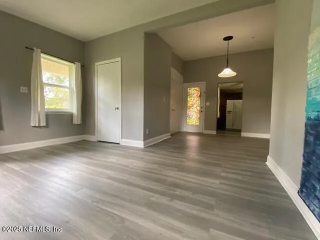 a view of a livingroom with wooden floor