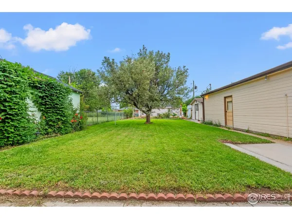 a backyard of a house with lots of green space