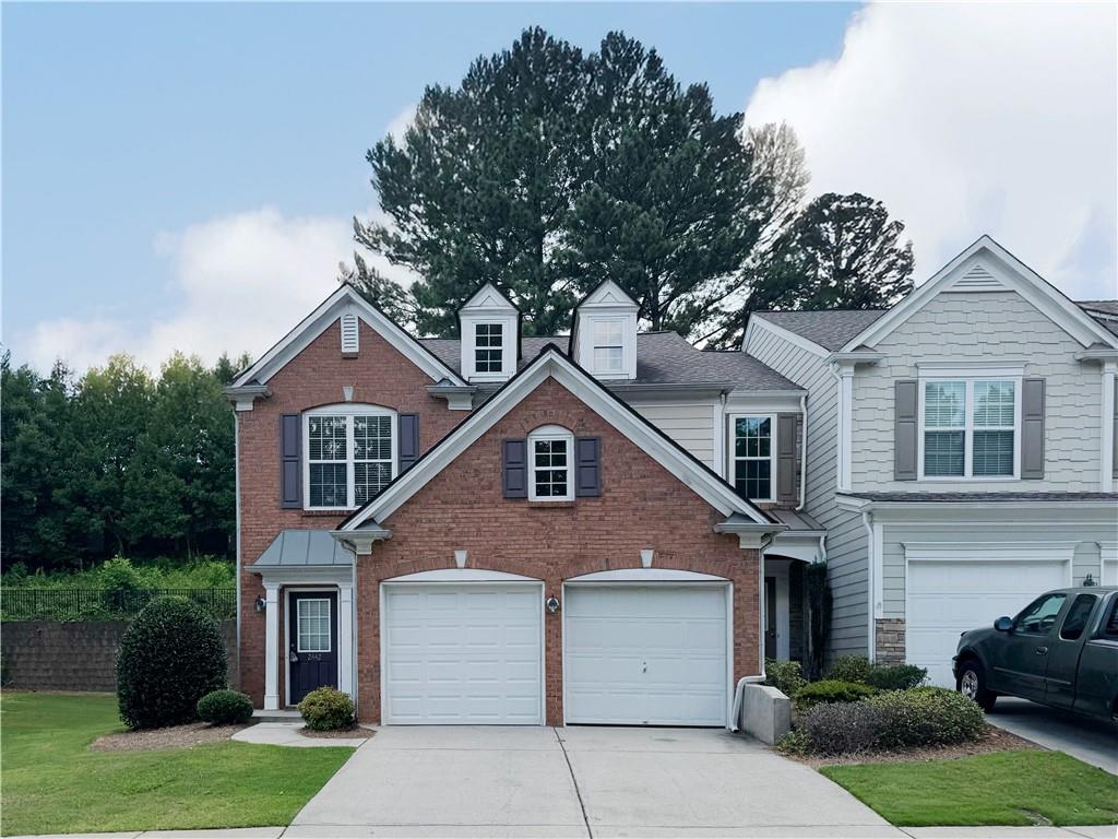 2442 Fairlie Drive Duluth, GA 30096 - Photo 1 of 1 a front view of a house with a yard and garage