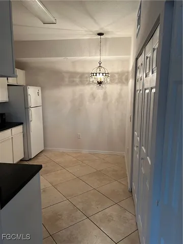 a kitchen with stainless steel appliances a stove a sink and a refrigerator