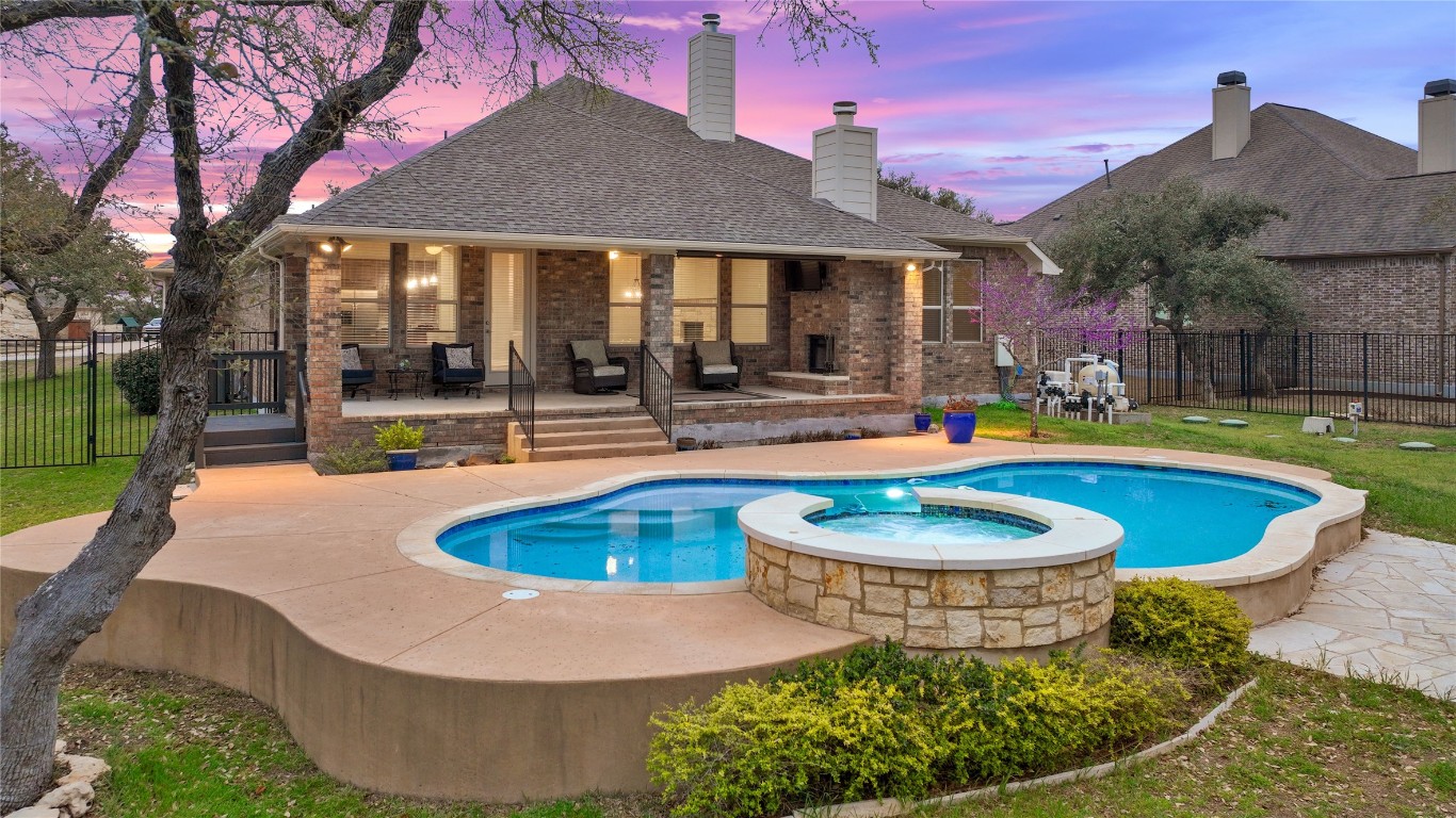 a view of a swimming pool with a patio