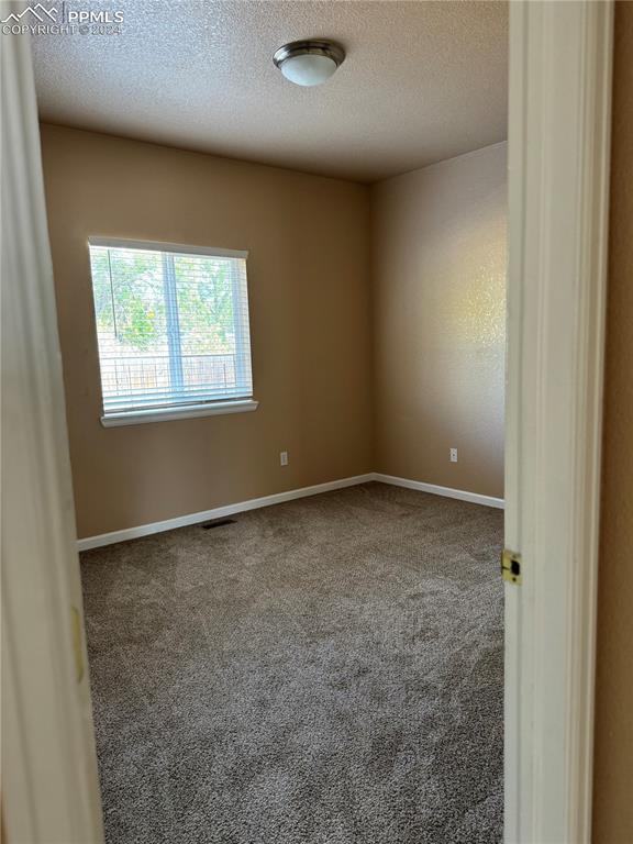 9395 Trailside View, Unit 1 Fountain, CO 80817 - Photo 11 of 13 an empty room with a window