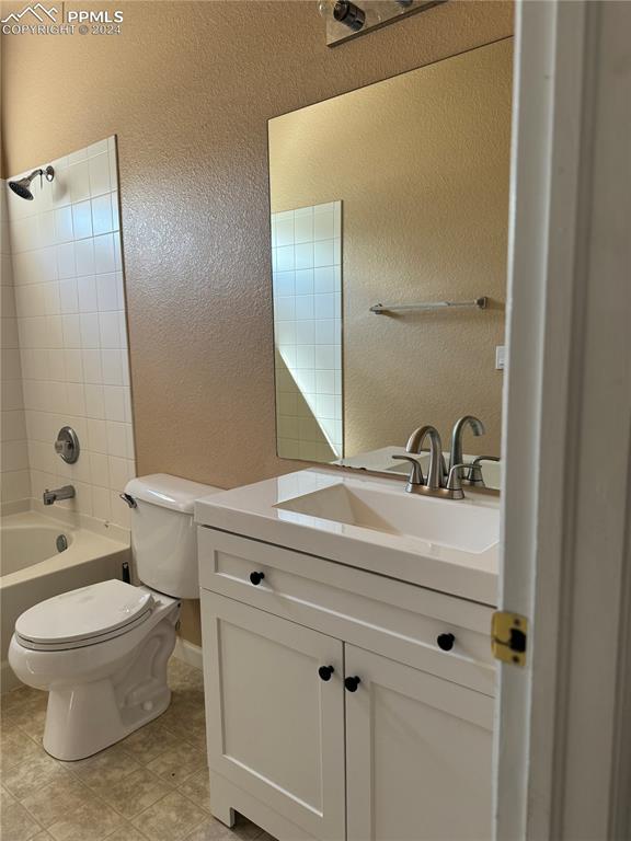9395 Trailside View, Unit 1 Fountain, CO 80817 - Photo 9 of 13 a bathroom with a sink a toilet and shower