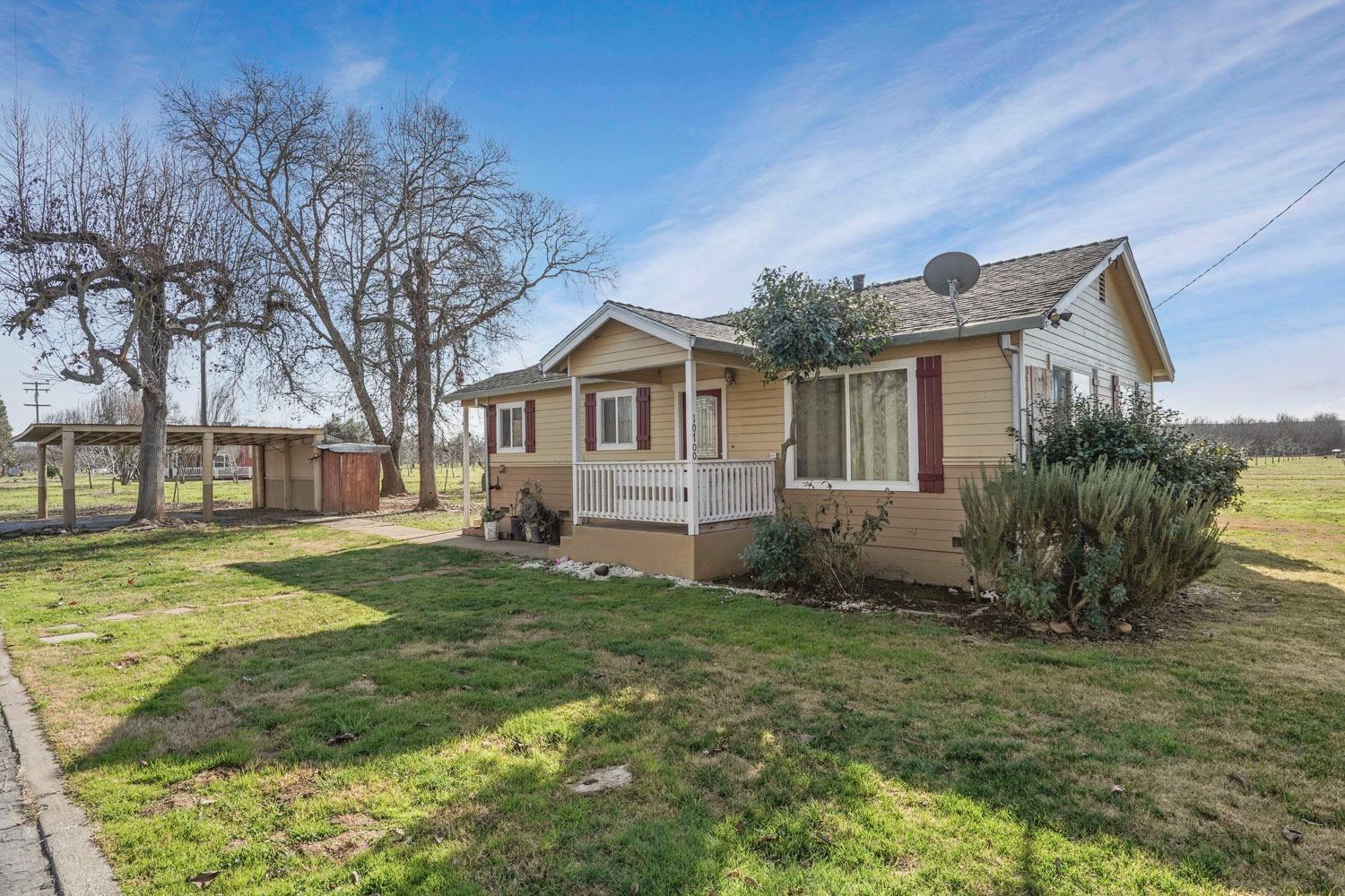 10710 North Shelton Road Linden, CA 95236 - Photo 26 of 75 a front view of a house with a garden