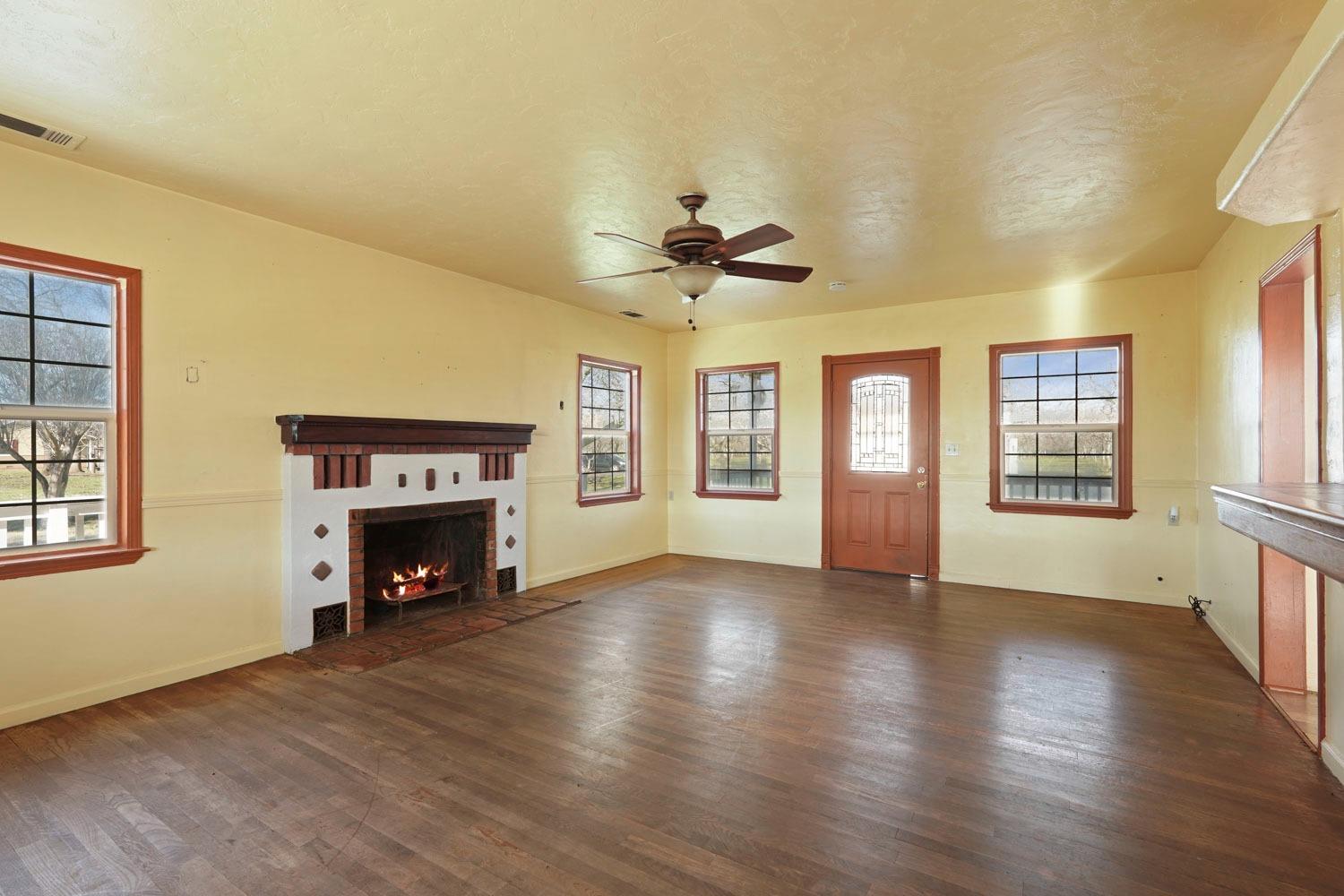 10710 North Shelton Road Linden, CA 95236 - Photo 37 of 75 a view of an empty room with a fireplace and a window