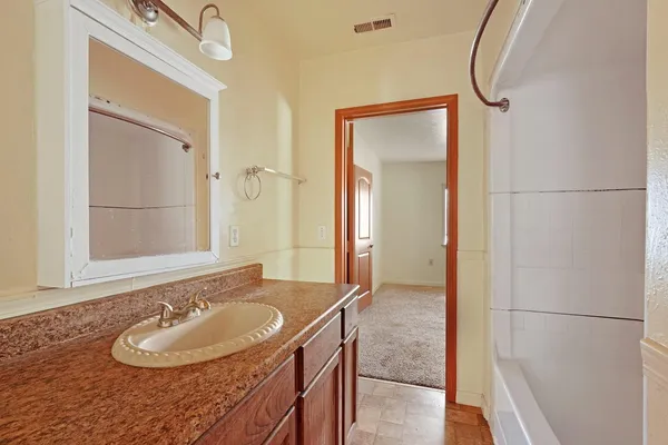 a view of a backyard with table and chairs