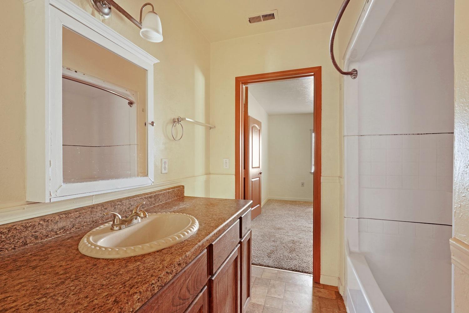 10710 North Shelton Road Linden, CA 95236 - Photo 44 of 75 a bathroom with a sink and a mirror