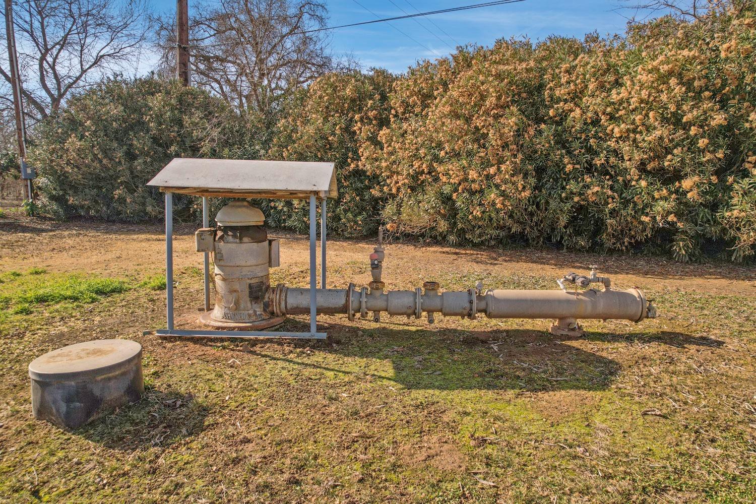 10710 North Shelton Road Linden, CA 95236 - Photo 5 of 75 a view of a backyard with water fountain and sitting area