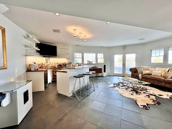 a kitchen with stainless steel appliances kitchen island granite countertop a sink and cabinets