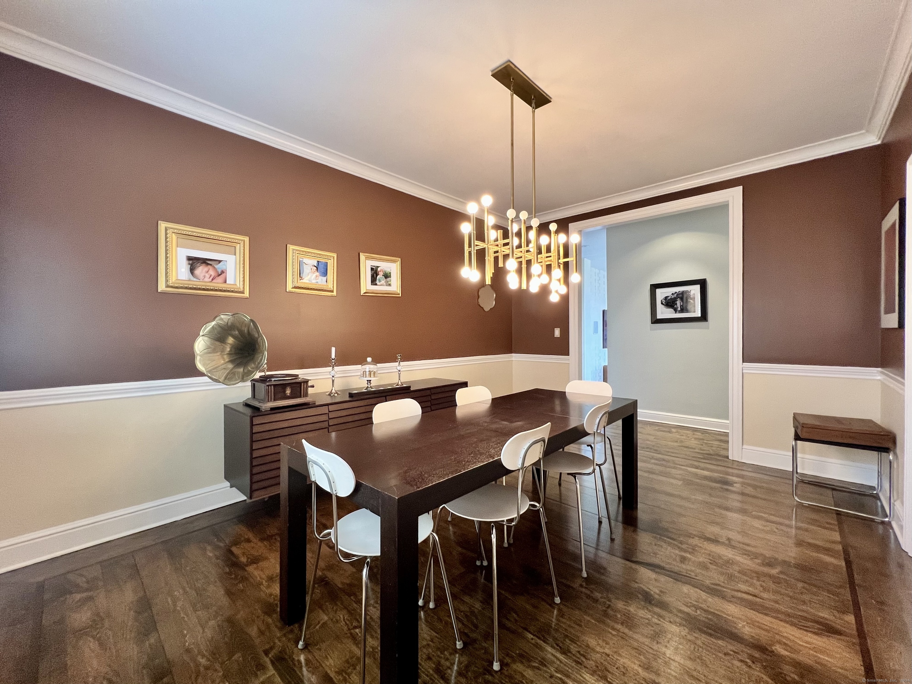 172 Umpawaug Road Redding, CT 06896 - Photo 18 of 38 a view of a dining room with furniture a chandelier and wooden floor