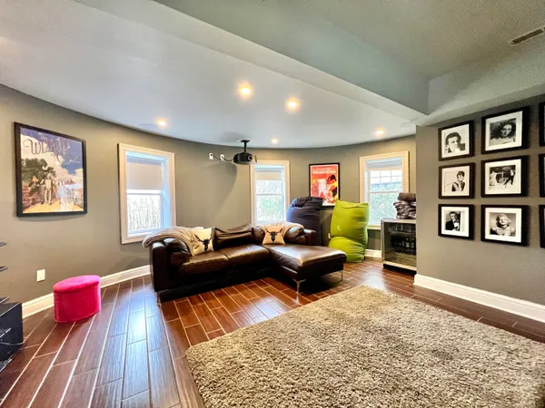 a living room with furniture or couch and a bookshelf