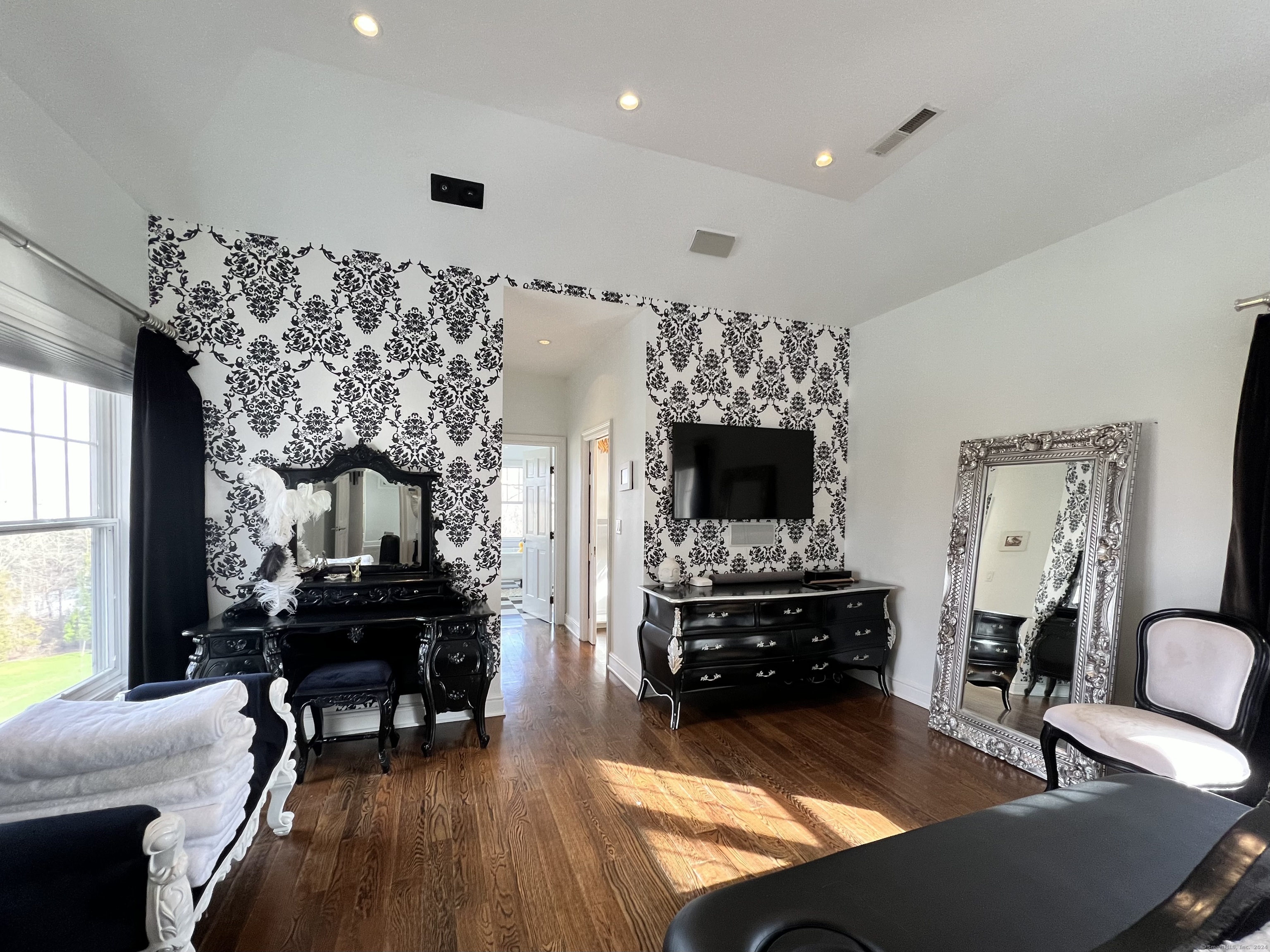 172 Umpawaug Road Redding, CT 06896 - Photo 20 of 38 a living room with furniture fireplace and a flat screen tv