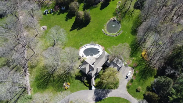a backyard of a house with lots of green space