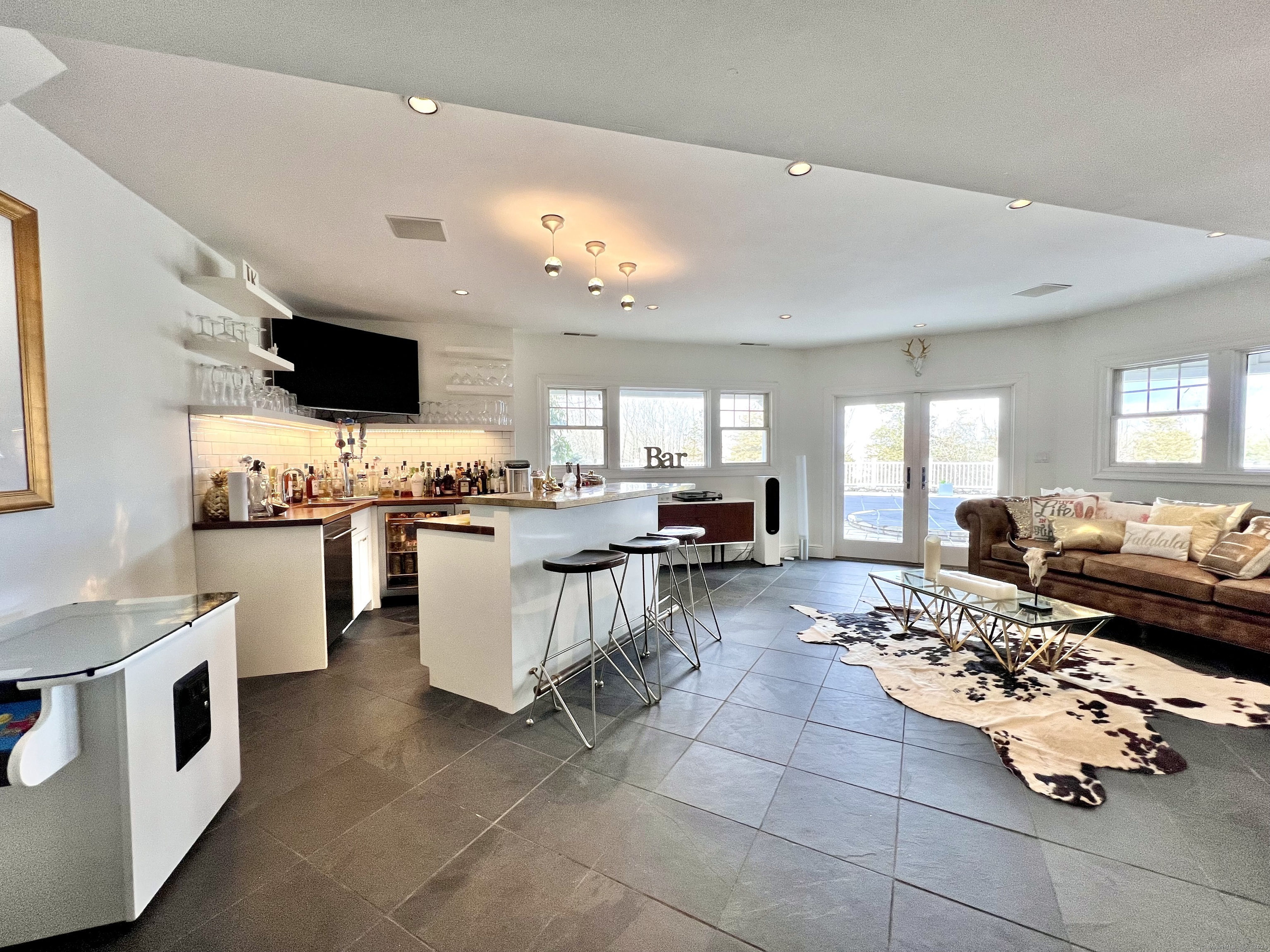 172 Umpawaug Road Redding, CT 06896 - Photo 27 of 38 a kitchen with stainless steel appliances kitchen island granite countertop a sink and cabinets