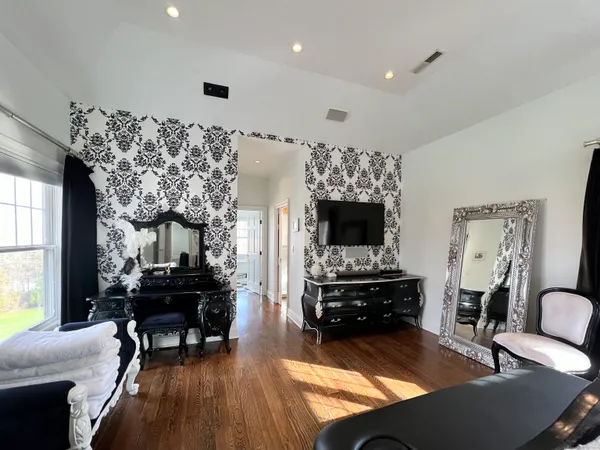 a living room with furniture fireplace and a flat screen tv