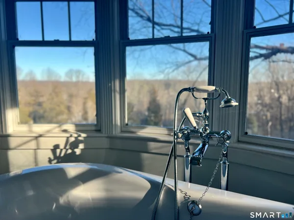 a bathroom with a sink and a large mirror