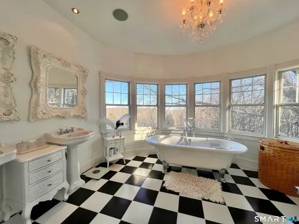 a very nice looking room with a large window and a dining table chair