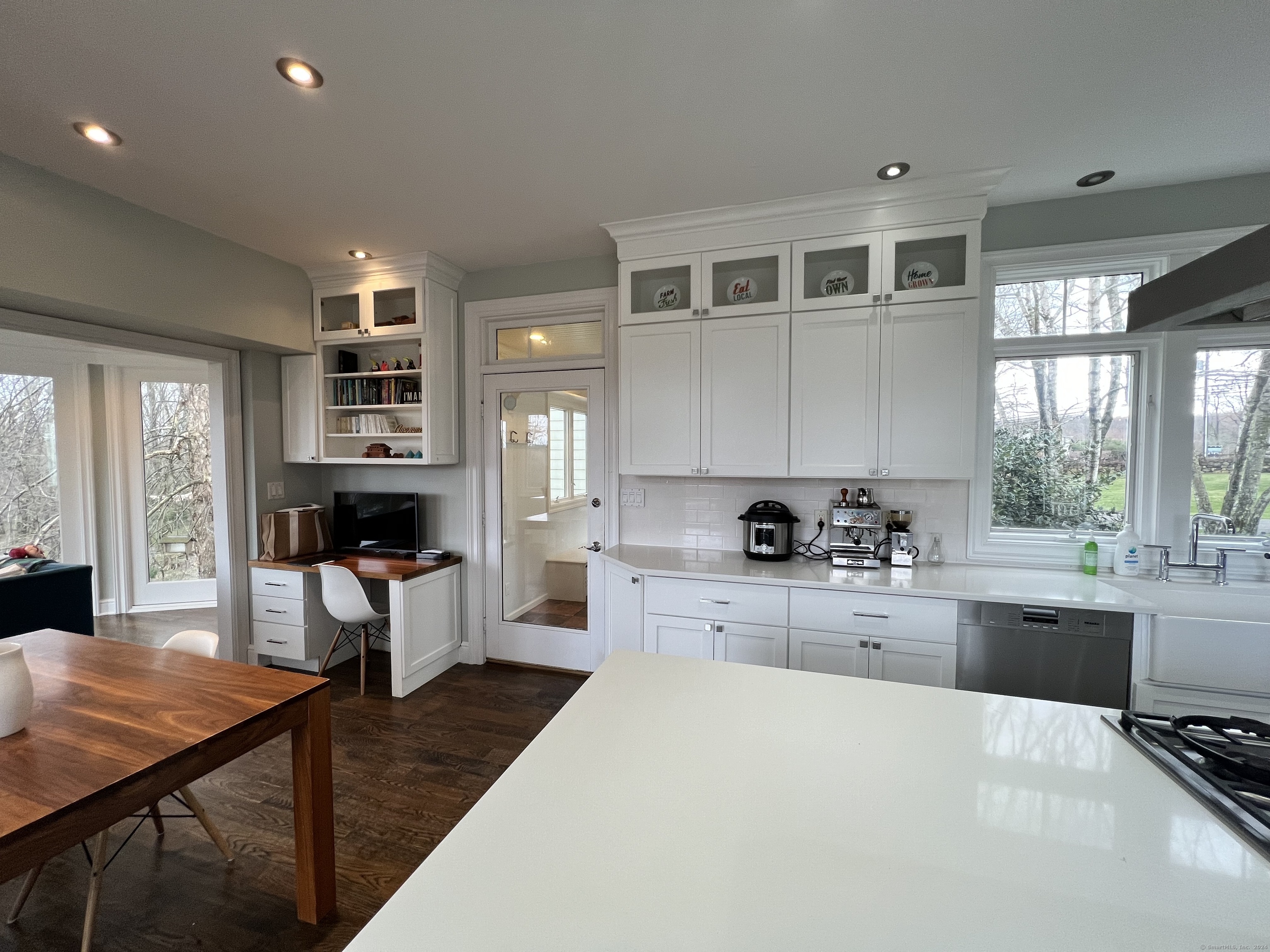 172 Umpawaug Road Redding, CT 06896 - Photo 7 of 38 a large kitchen with kitchen island a large window cabinets and stainless steel appliances