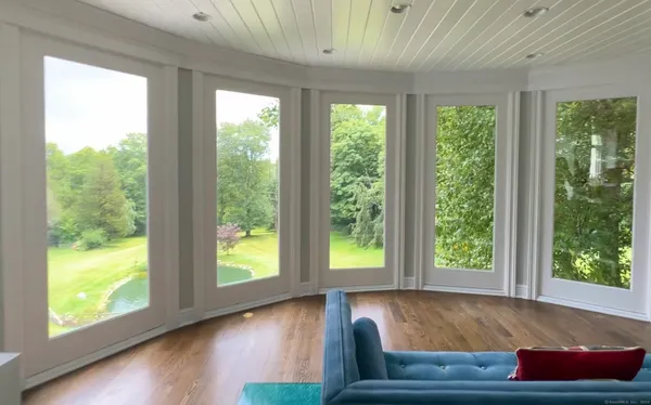 a room with furniture and a large window