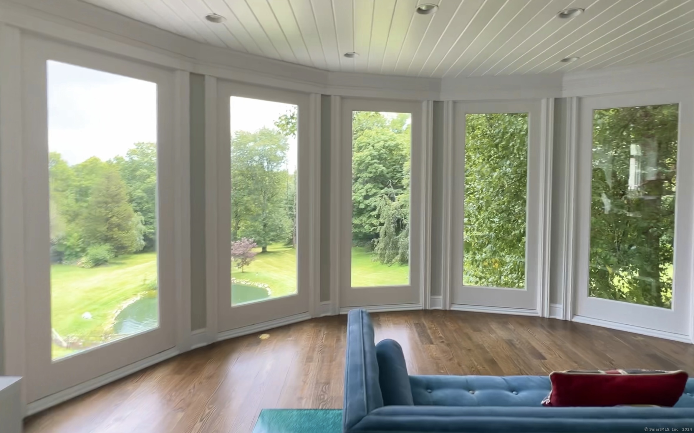 172 Umpawaug Road Redding, CT 06896 - Photo 8 of 38 a room with furniture and a large window