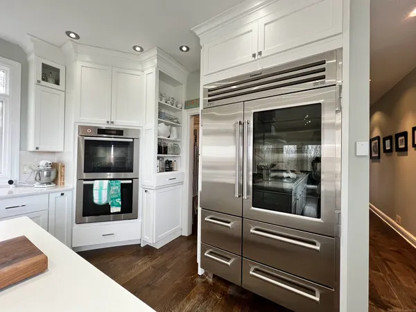a kitchen with a refrigerator and stove