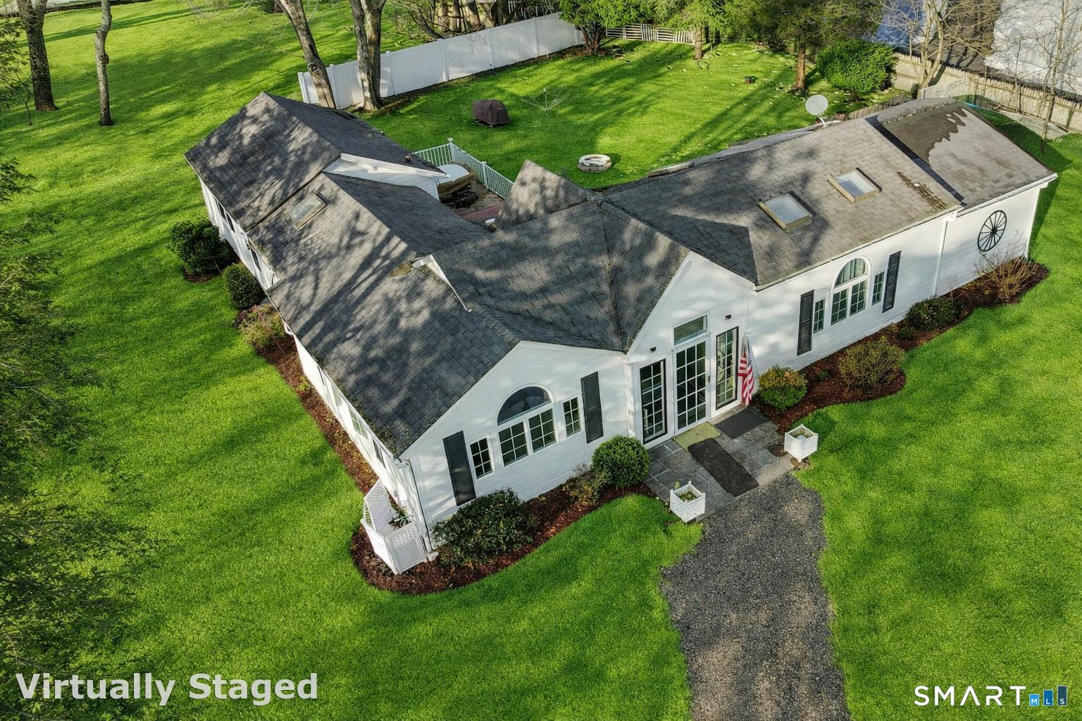 1215 Westover Road Stamford, CT 06902 - Photo 1 of 27 a view of a house with a big yard