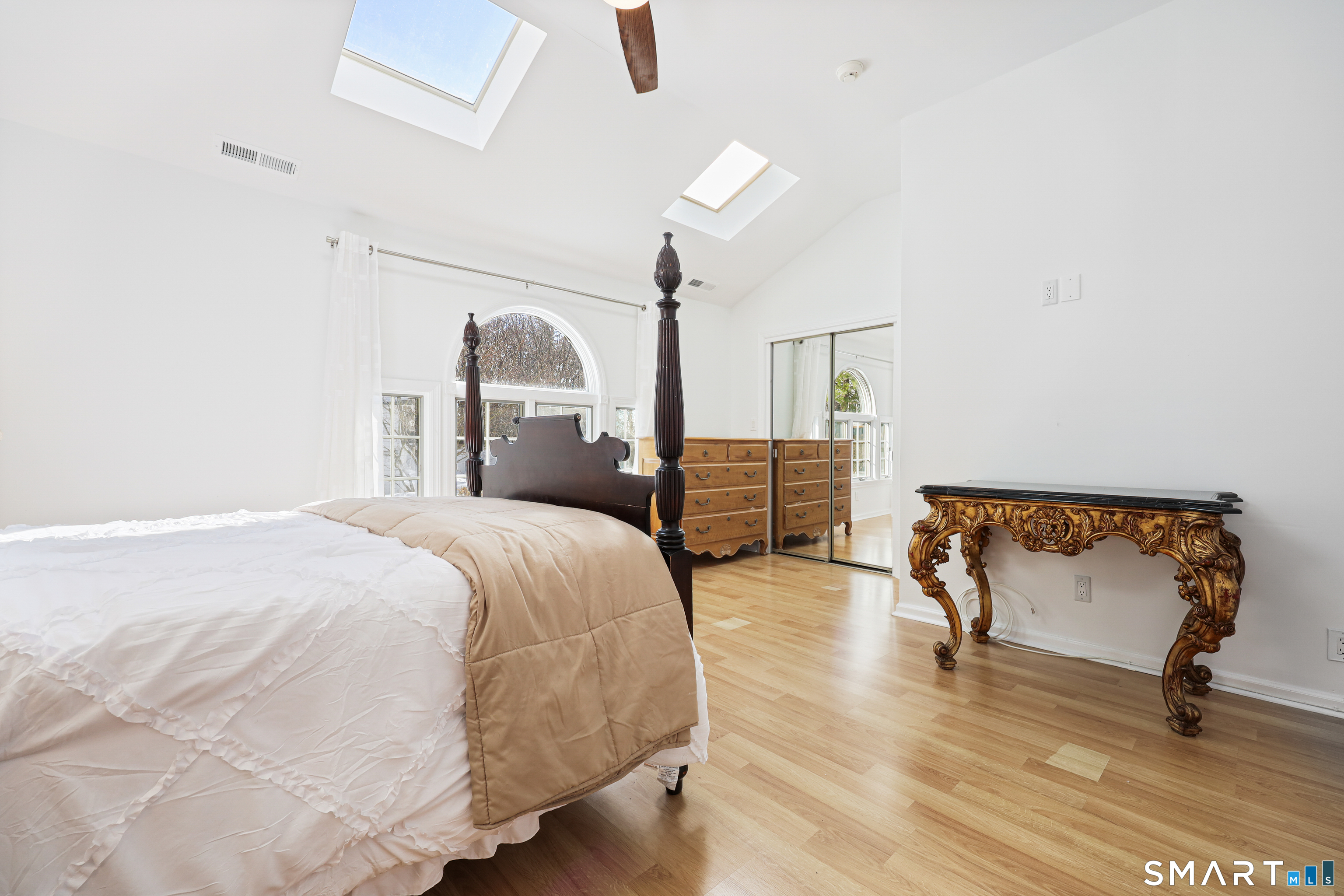 1215 Westover Road Stamford, CT 06902 - Photo 12 of 27 a spacious bedroom with a bed and a chair