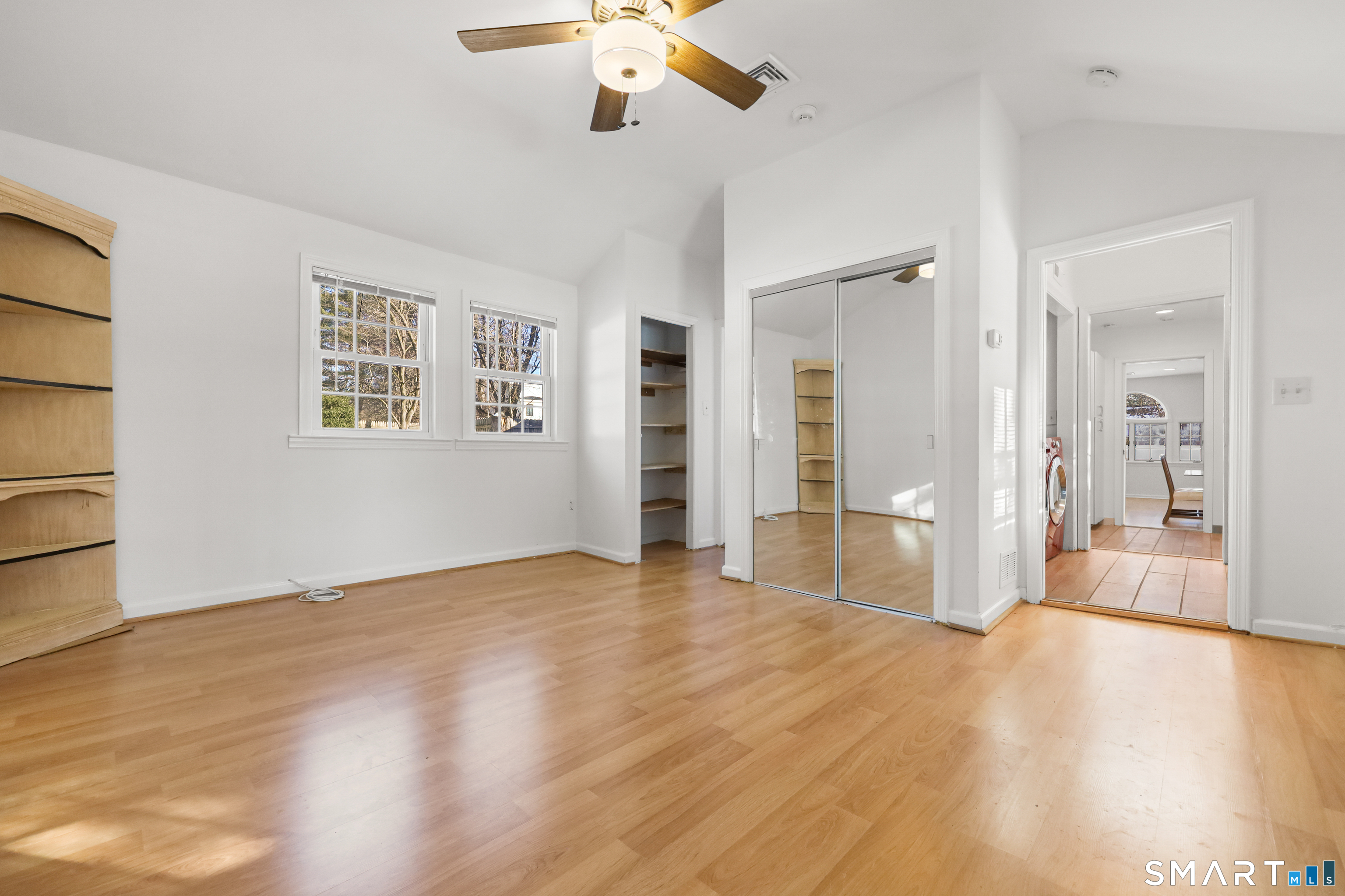 1215 Westover Road Stamford, CT 06902 - Photo 15 of 27 wooden floor in an empty room with a window