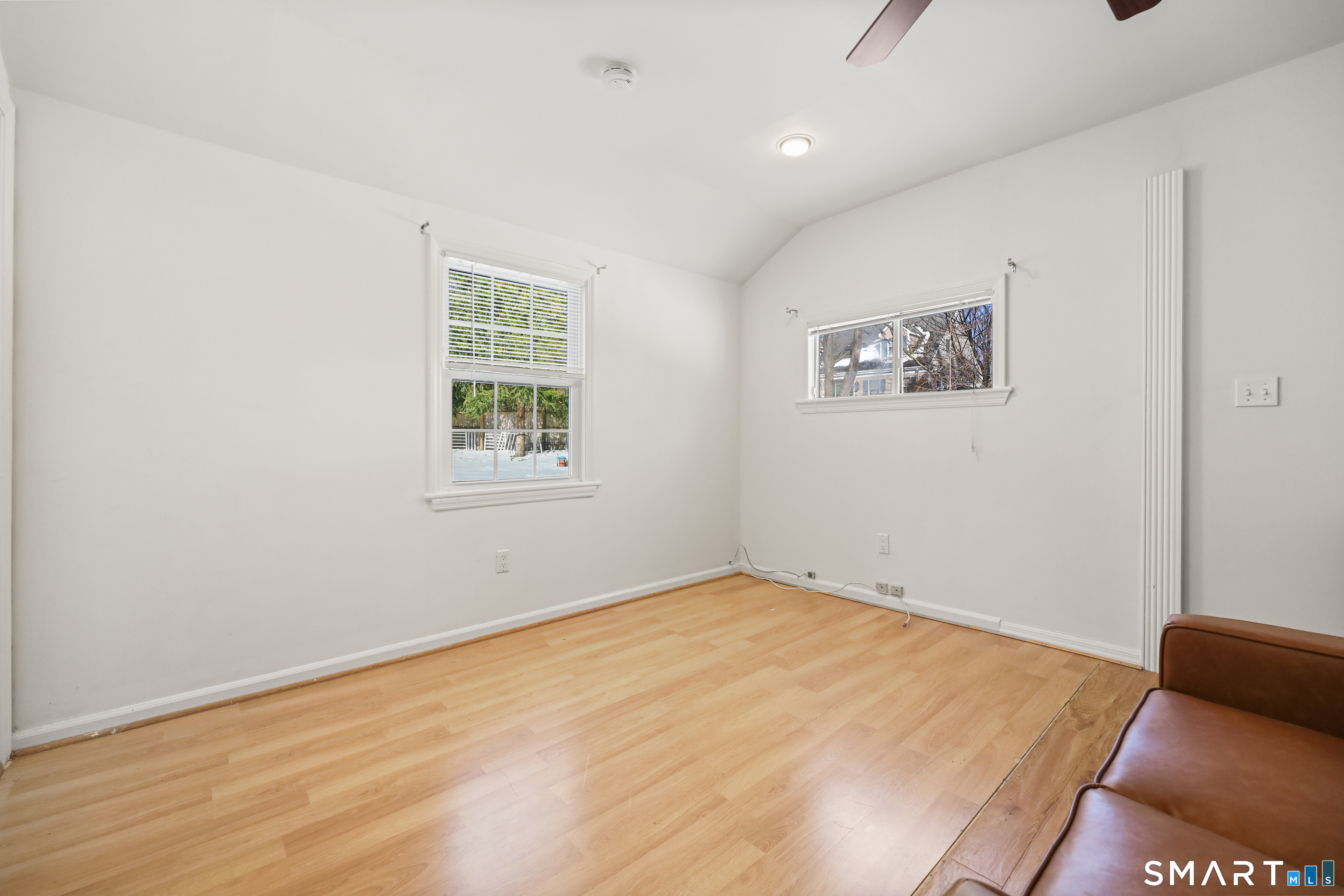 1215 Westover Road Stamford, CT 06902 - Photo 19 of 27 a view of room with window and wooden floor