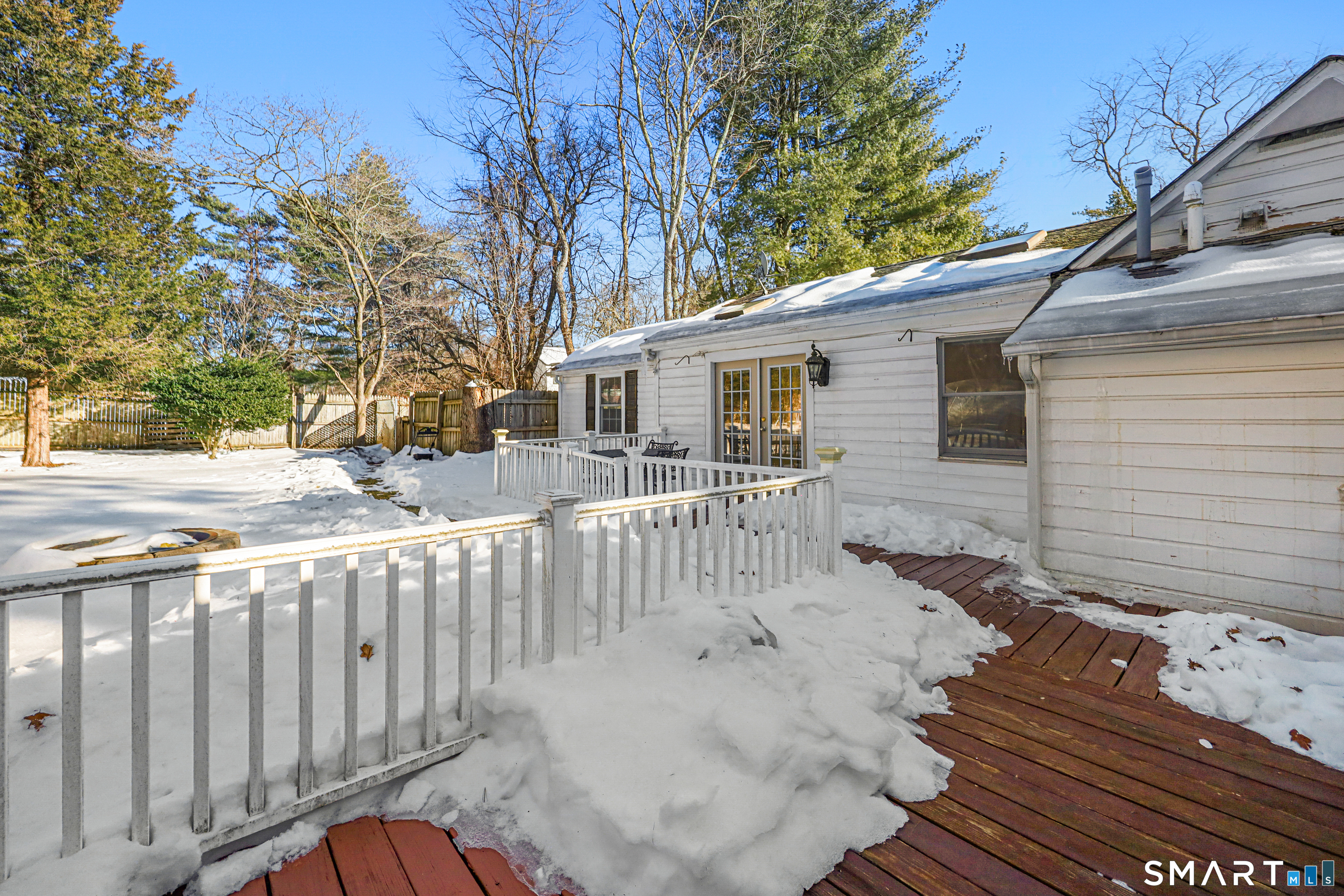 1215 Westover Road Stamford, CT 06902 - Photo 23 of 27 a view of a house with wooden fence