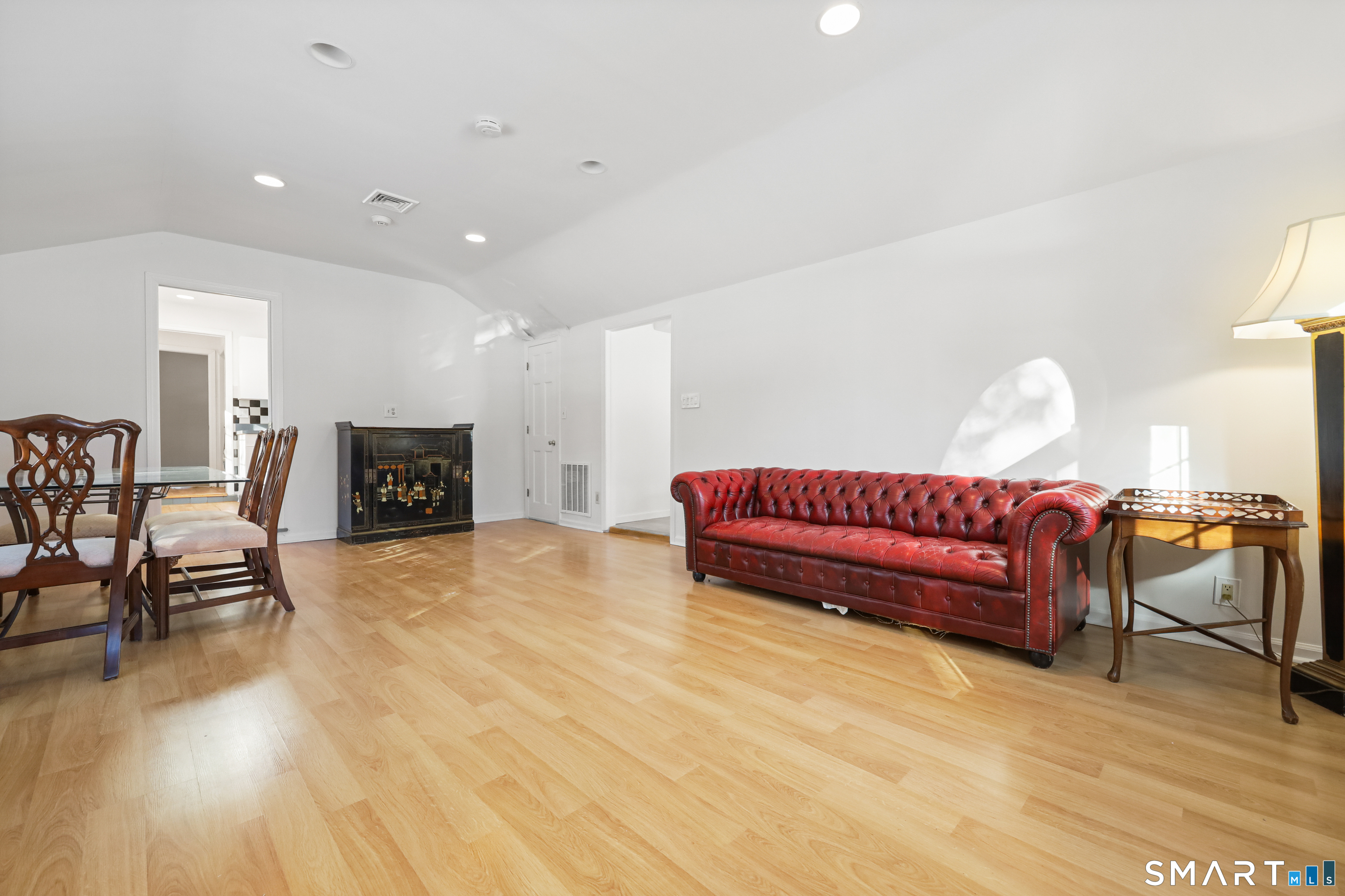 1215 Westover Road Stamford, CT 06902 - Photo 4 of 27 a living room with furniture and a fireplace