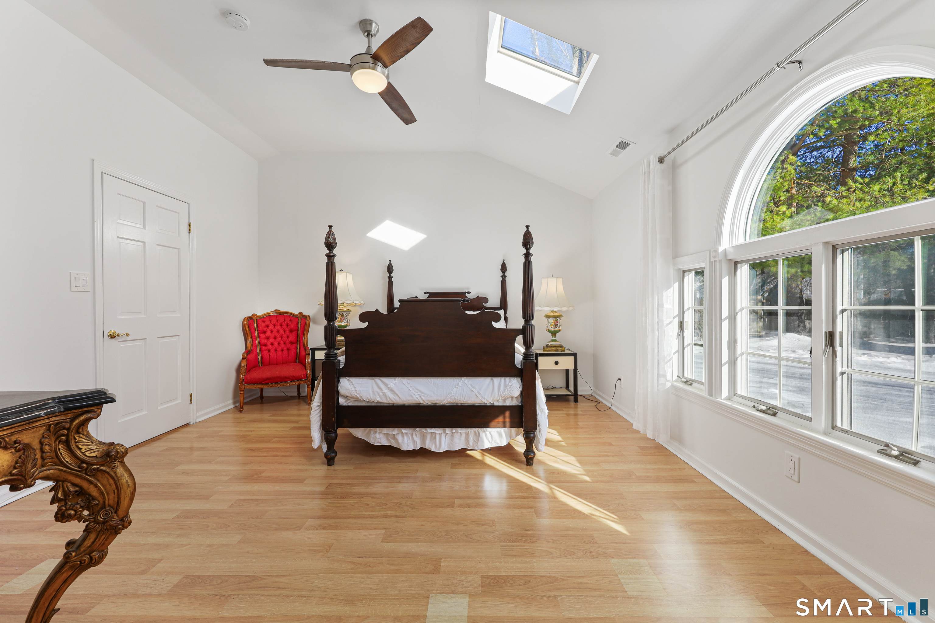 1215 Westover Road Stamford, CT 06902 - Photo 10 of 27 a bedroom with furniture and a window