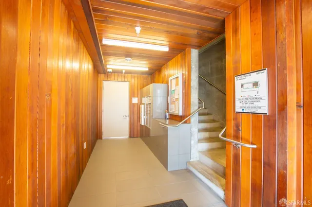a view of a bathroom with shower and a window