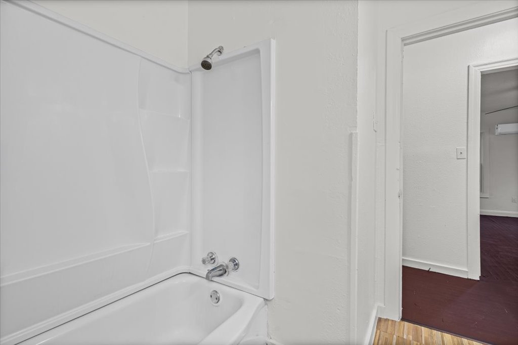 2206 Rountree Drive Austin, TX 78722 - Photo 13 of 16 a bathroom with a bathtub