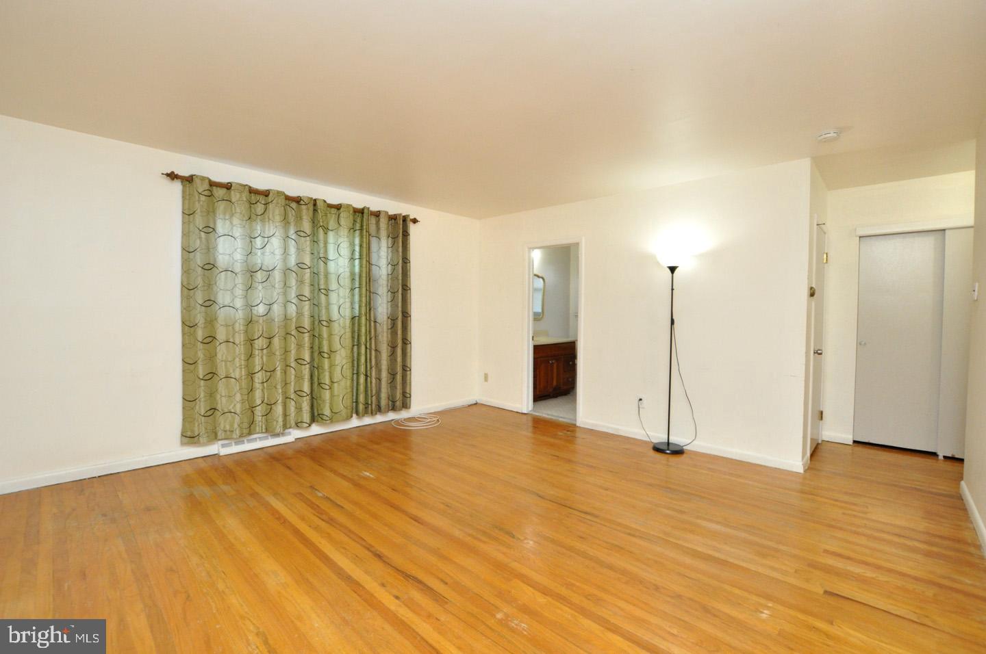 210 Philellena Road Cherry Hill, NJ 08034 - Photo 15 of 30 a view of an empty room with wooden floor