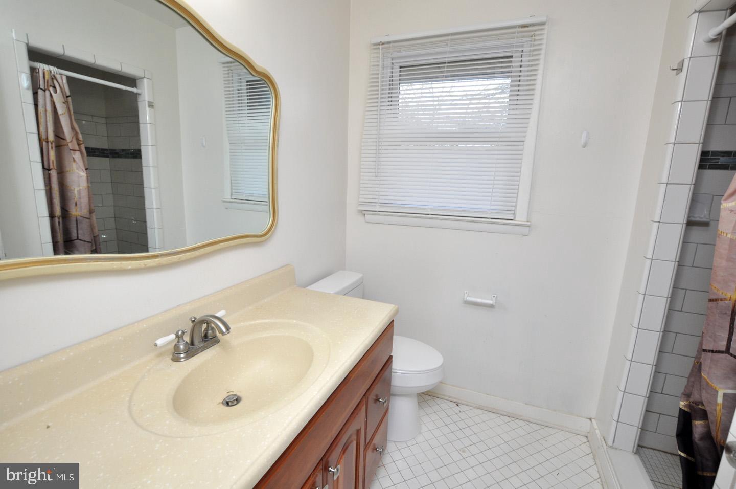 210 Philellena Road Cherry Hill, NJ 08034 - Photo 17 of 30 a bathroom with a sink and a toilet