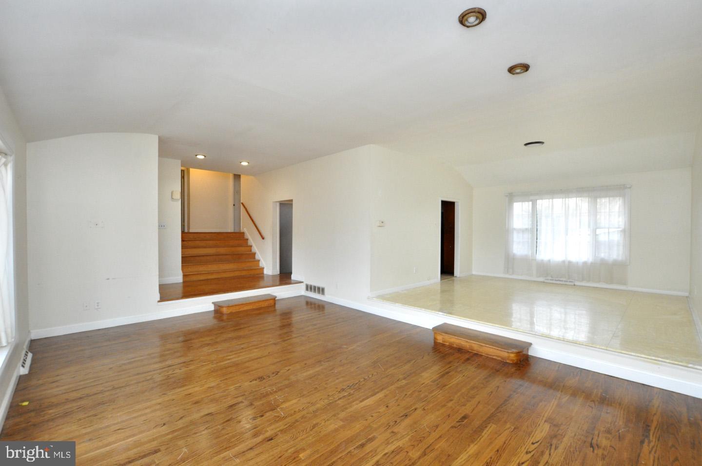 210 Philellena Road Cherry Hill, NJ 08034 - Photo 3 of 30 wooden floor in an empty room with a window
