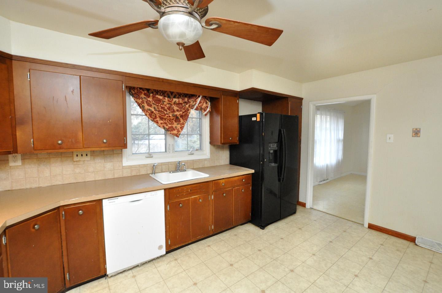 210 Philellena Road Cherry Hill, NJ 08034 - Photo 9 of 30 a kitchen with a stove a sink and a refrigerator