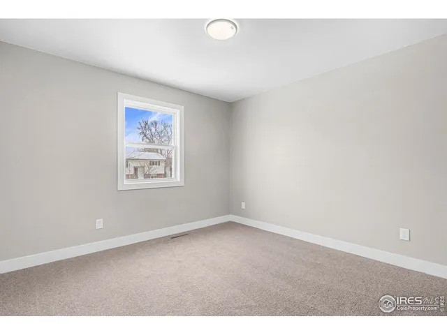 an empty room with a bench