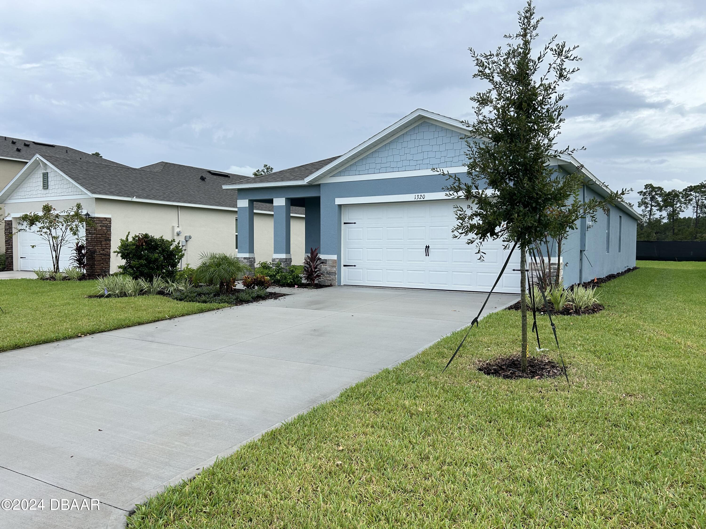 a house view with a garden space