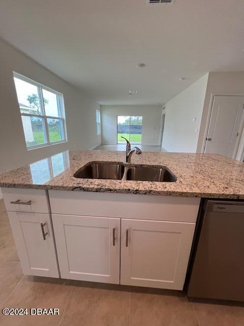 1320 Cork Drive Ormond Beach, FL 32174 - Photo 9 of 25 a kitchen with granite countertop a sink and a stove