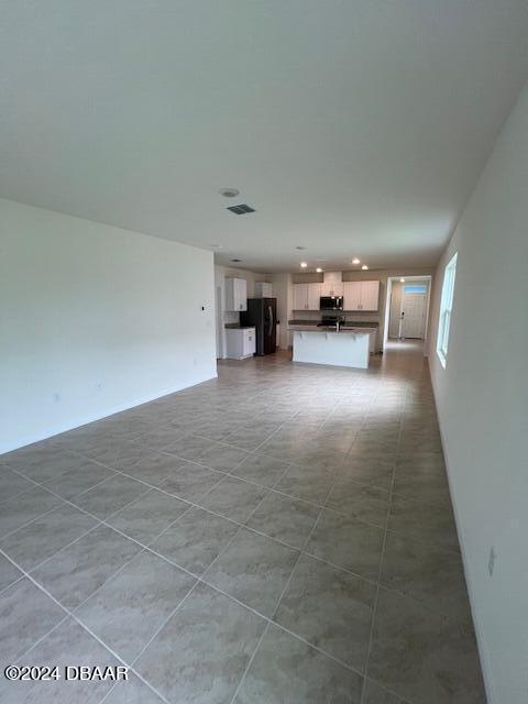 1320 Cork Drive Ormond Beach, FL 32174 - Photo 10 of 25 a view of a livingroom with furniture and an empty room