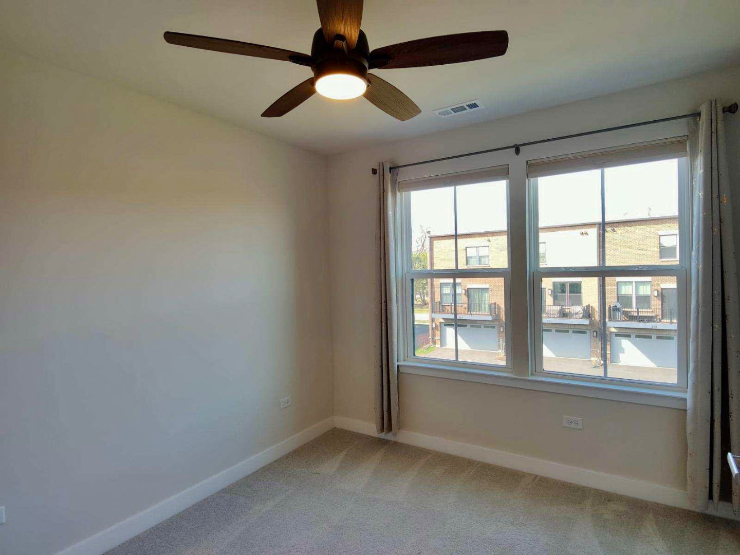 319 Elm Ct., Unit 319 Mount Prospect, IL 60056 - Photo 17 of 21 wooden floor in an empty room with a window